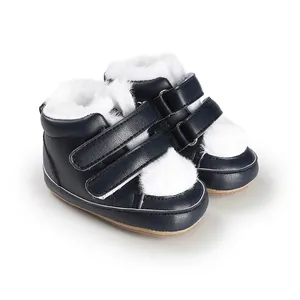 Cozy navy blue baby winter boots with soft white faux fur lining and Velcro straps.