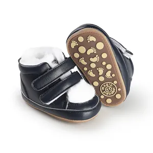 Detail view of navy baby winter boots with warm faux fur lining and non-slip sole