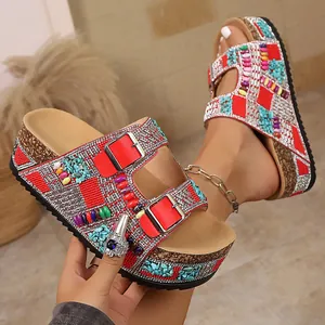 Detail view of bohemian rhinestone double buckle sandals with colorful beaded patterns
