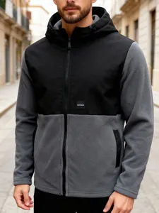 Detail of a men's color-blocked fleece hooded jacket with a full-zip and side pockets.