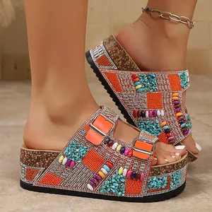 Close-up of vibrant platform sandals with rhinestones and colorful bead embellishments