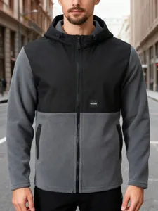 Close-up detail of a men's two-tone fleece hooded jacket featuring black and grey panels