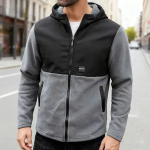 Detailed macro view of men's color-block polar fleece hoodie jacket with front zipper