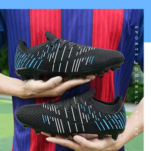 Detailed side view of black soccer cleats featuring blue and white stripes and spikes.