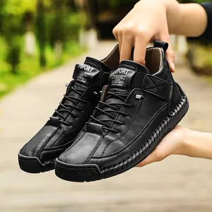 Detailed close-up of black mid-top men's Martin boots featuring contrast stitching.