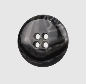 Macro detail of high-end dark grey marbled urea button with four holes for workwear garments