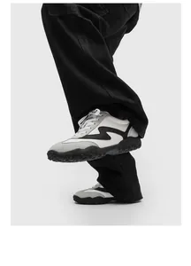 Detail view of men's stylish leather German Army Trainers with a thick black sole