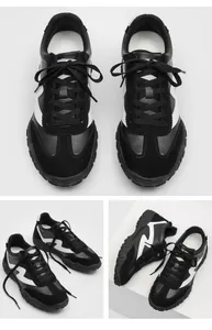 Multiple angles of black and white racing style sneakers with 7cm height increasing sole