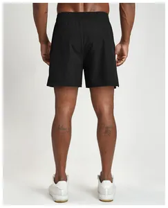 Men's black quick-dry athletic shorts shown from the back for fitness and sports