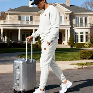 Men's luxury white jacquard knit tracksuit set shown in professional travel street scene