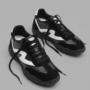 Stylish men's 7cm height increasing German trainer racing shoes in black and white leather.