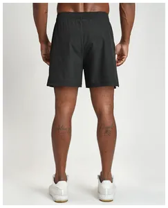 Rear view of breathable black quick-dry sports shorts for men during fitness training