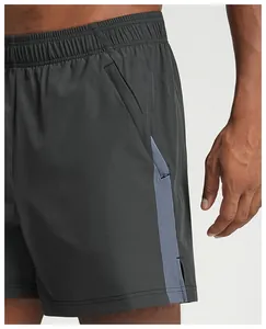 Detail view of men's quick-dry sports shorts with side pocket and contrast panel