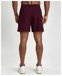 Detailed back view of men's quick-dry breathable athletic shorts in deep burgundy