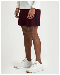 Detailed side view of breathable burgundy men's sports shorts with side stripes