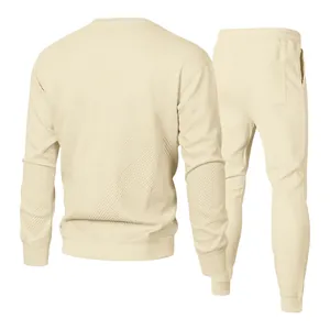 Back view of cream jacquard knitted men's tracksuit set with geometric pattern