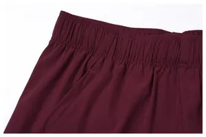Close-up detail of maroon quick-dry breathable sports shorts waistband and side pocket