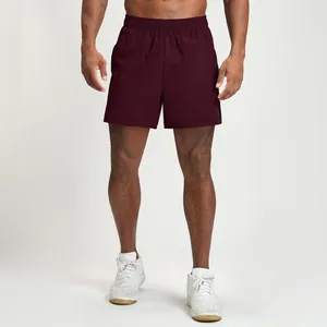 Professional men's quick-dry athletic sports shorts in burgundy with side contrast stripes