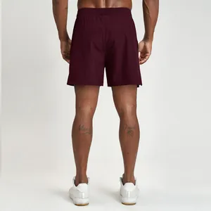Back view of men's burgundy quick-dry breathable athletic shorts for gym fitness
