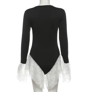 Back view detail of a black slim fit long-sleeved bodysuit with white lace trim.