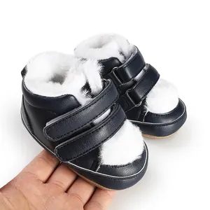 Navy blue baby pre-walker shoes with soft white faux fur lining and velcro straps