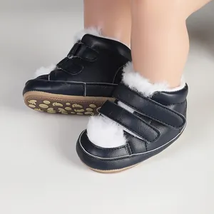 Detail of navy blue baby walking shoes featuring white fur trim and dual straps