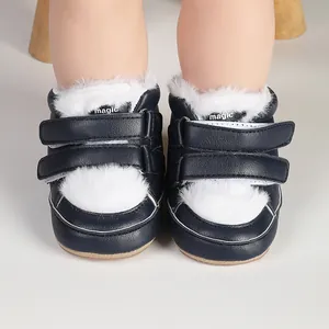 Detail shot of navy blue baby walker shoes with soft white faux fur and dual velcro straps.