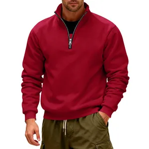Detailed view of the metallic half-zip stand collar on a premium red fleece sweatshirt.