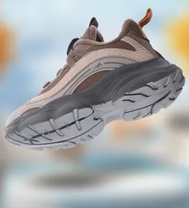 Close-up bottom view of girls' athletic shoe with chunky sole and dial buckle lacing