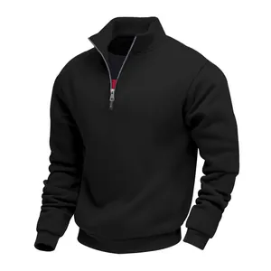 Close-up detail of a premium black heavyweight half-zip sweatshirt with a stand-up collar.