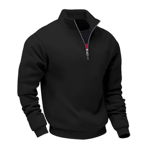 Detail of the metal half-zip and stand-up collar on a black heavyweight sweatshirt.