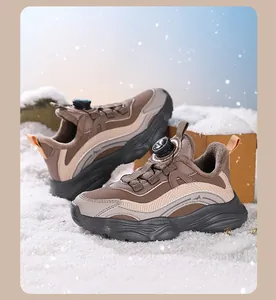 Detailed view of girls' brown rotary buckle winter sneakers with warm fleece lining