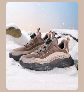 Detail shot of girls' winter sneakers with warm plush lining and rotary buckle closure