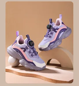 Detailed view of purple girls' running shoes featuring a convenient rotary buckle