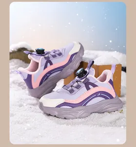 Detailed view of girls' purple and pink sneakers with mesh and rotary buckle dial.