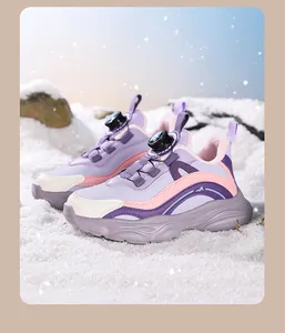 Detailed view of girls' purple mesh sneakers featuring a rotating dial lace system.
