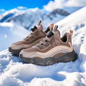 Warm winter sneakers for girls with rotary dial buckle on snowy mountain background.