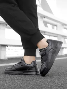 Side view of durable black children's low-top sports shoes for student campus wear.