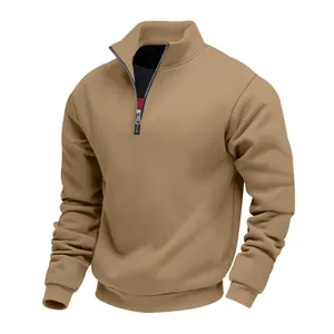 Detail view of heavy camel half-zip sweatshirt with stand collar and ribbed cuffs