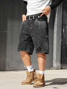 Detail view of men's rhinestone distressed denim shorts with loose straight fit.