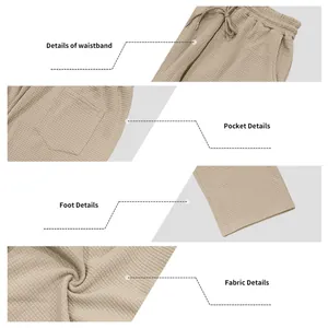 Detailansicht der Waffelstrickhose für Herren mit Bund, Tasche und Stoffstruktur.