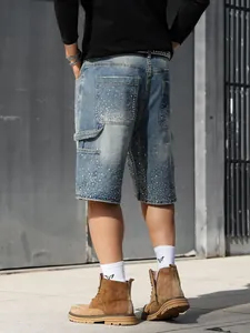 Rear view of men's blue denim carpenter shorts with glittering rhinestone accents.