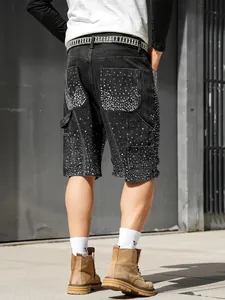 Close-up of men's loose denim carpenter shorts featuring sparkling rhinestone accents.