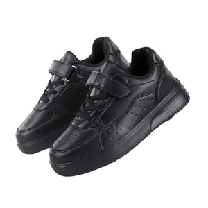 Classic black low-top children's school sneakers with velcro strap and laces for daily wear