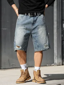 Detailed shot of men's blue distressed denim cargo shorts with sparkling rhinestones