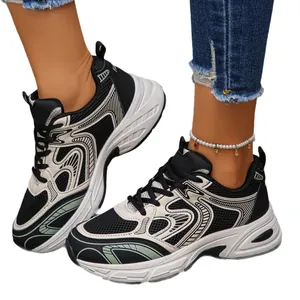 Stylish black and white chunky sneakers with breathable mesh and thick soles for unisex wear