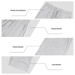 Dettagli della vita elastica, delle tasche e dell'orlo dei pantaloni sportivi grigi.