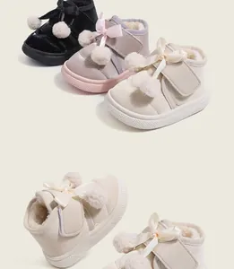 Winter kids fur-lined cotton shoes with pom-poms and bowknots in multiple colors.