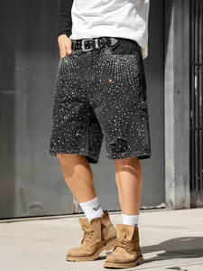 Men's loose fit black rhinestone studded distressed denim carpenter shorts for street fashion.