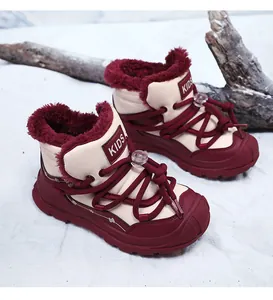 Detailed view of warm burgundy children's snow boots featuring thick faux fur lining.